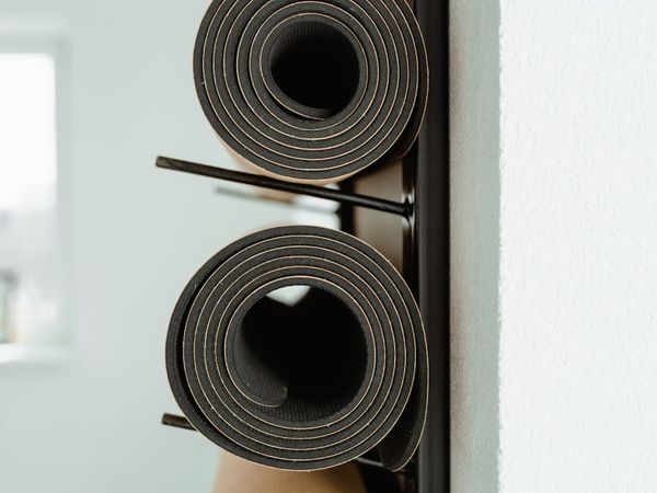 A welcoming and clean studio space with yoga mats.